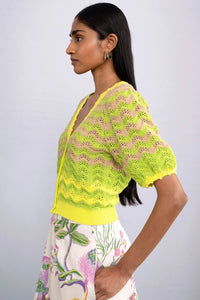 Side view of model wearing Kate Chevron Cardigan Chive.