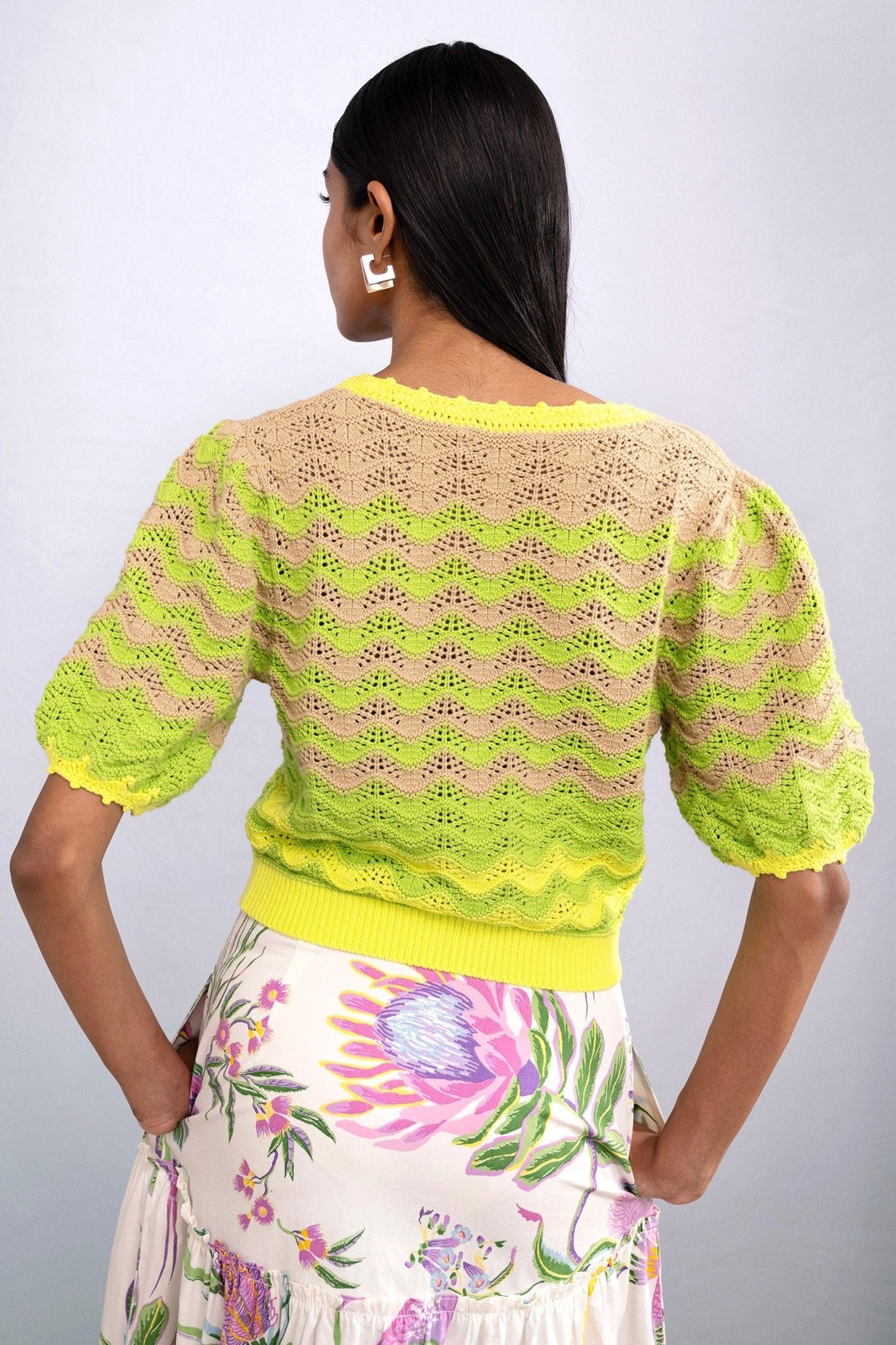 Back view of model wearing Kate Chevron Cardigan Chive