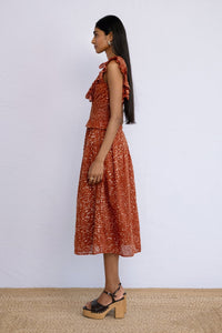 Side view of model wearing Keira Dress in block printed Bondi Batik print, Tobacco colour.