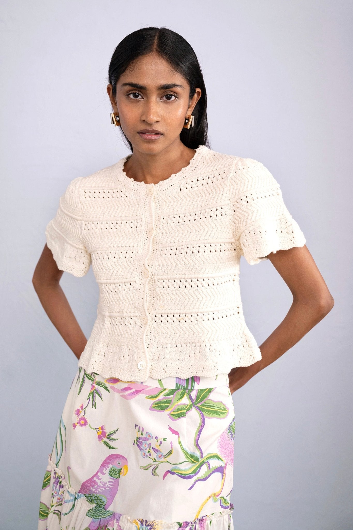 Front view of model wearing Laura Crochet Cardigan in Cream.