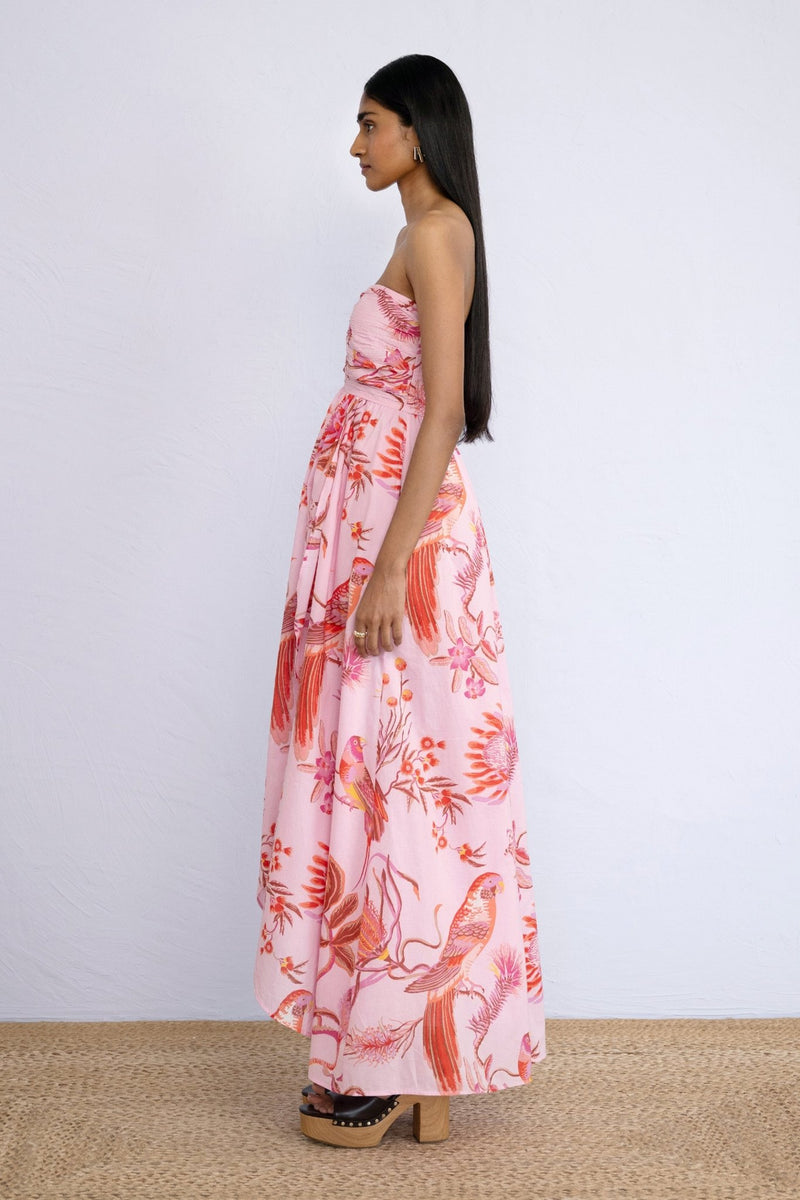 Side view of model standing wearing strapless Madison Dress in Botany Bay Pink Mist print.