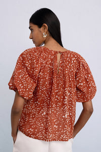 Back view of model wearing Oana Top in Bondi Batik, color Tobacco.