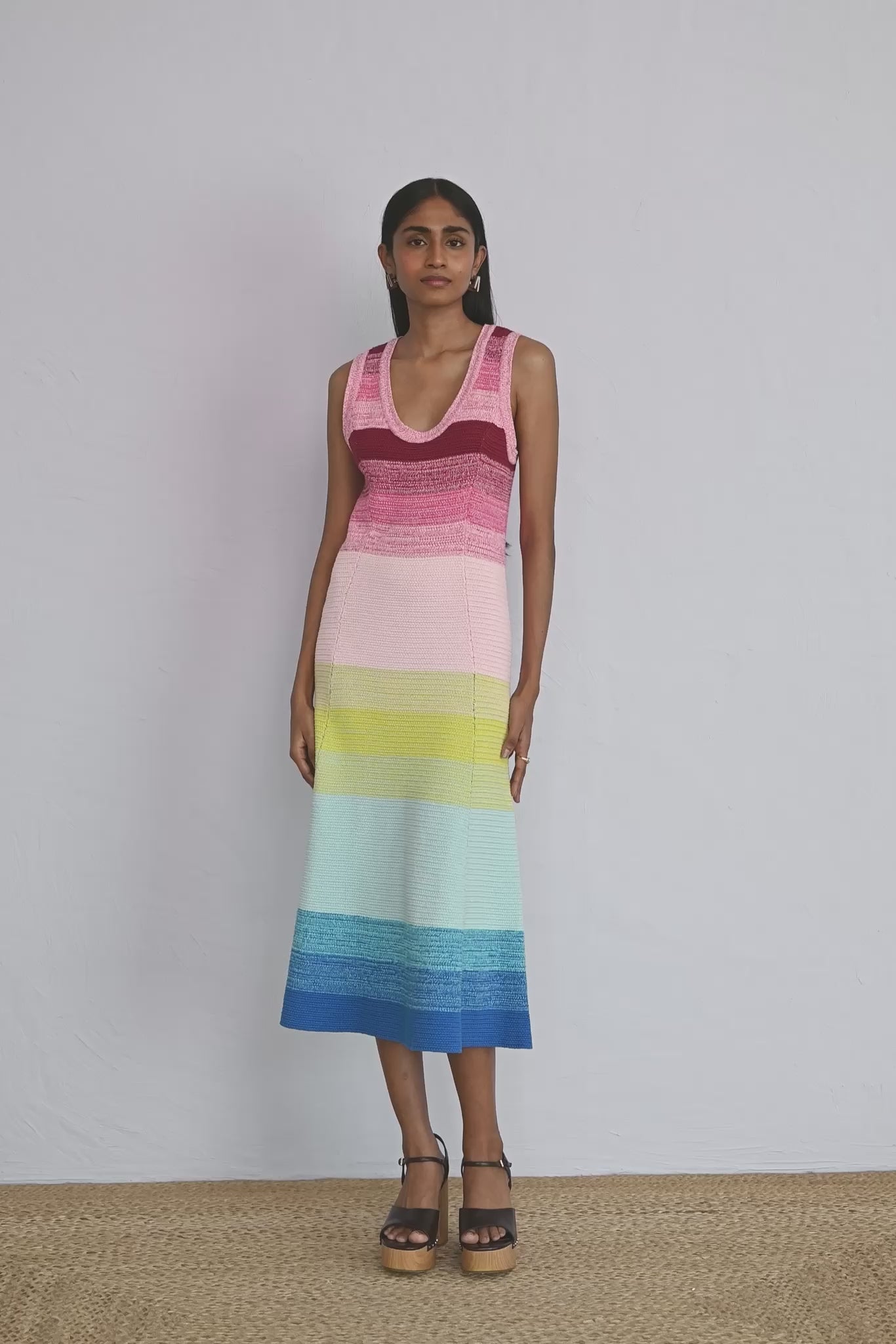 Video of model wearing the Genoa Dress Bloom Ombre showing all sides of the knit dress.