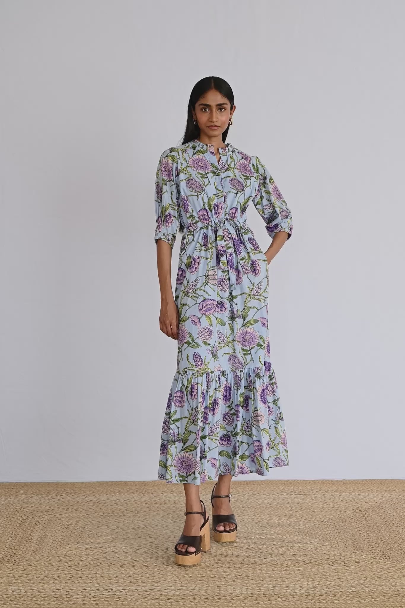 Video of model wearing Betty Dress in Protea Orchid print showing all sides of the dress.