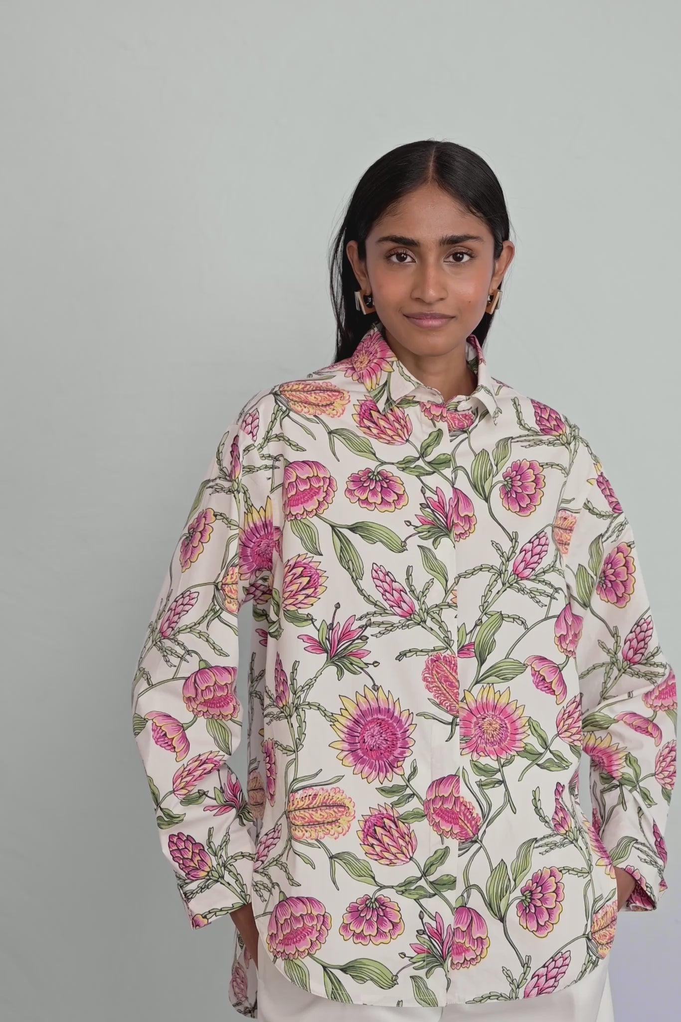 Video of model wearing Charlotte Shirt in Protea Cypress print showing all sides of shirt.