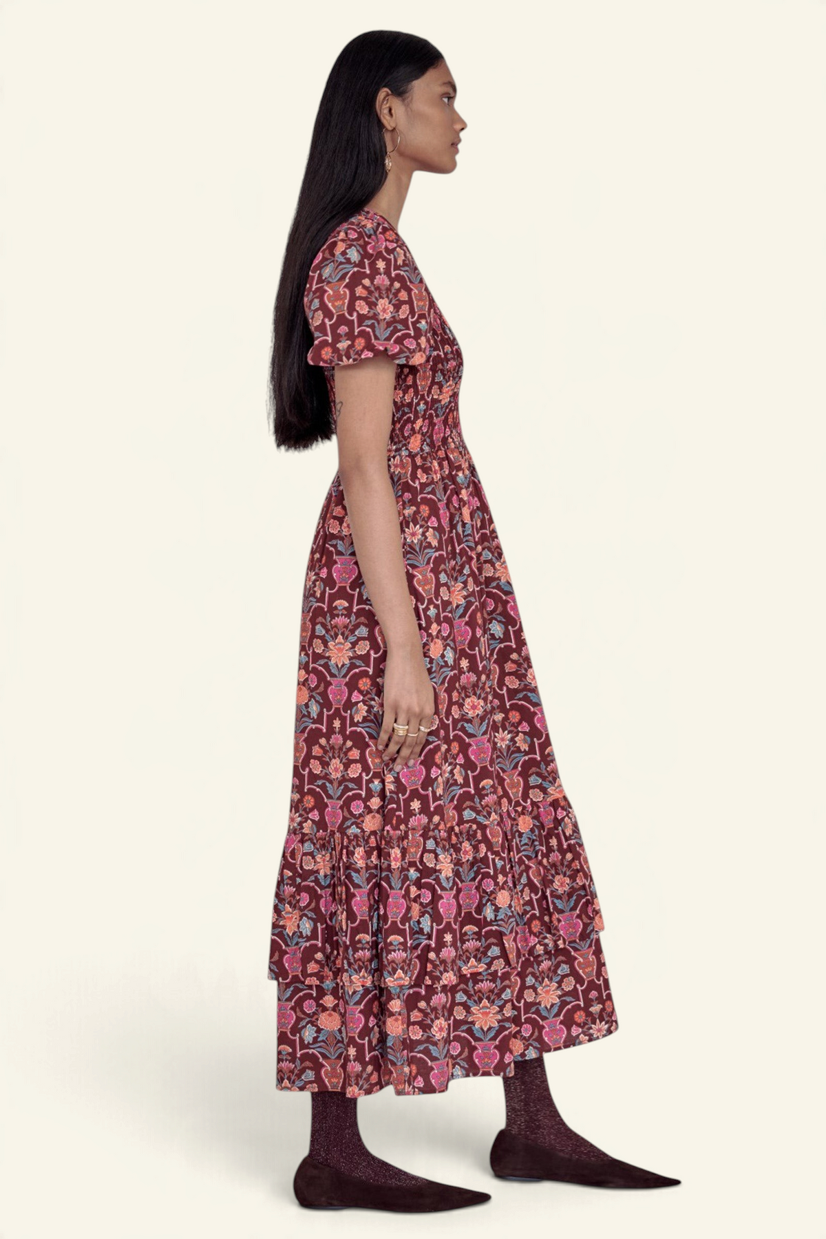 Banjanan Quant dress in chestnut floral vase print with smocked bodice, puffed sleeves, and tiered midi skirt.