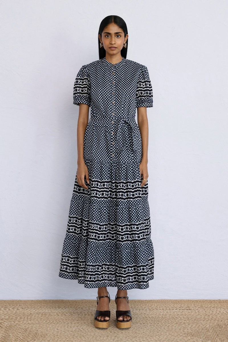 Front view of model standing wearing a full length Saylor Dress in Victorian Gingham Midnight print.